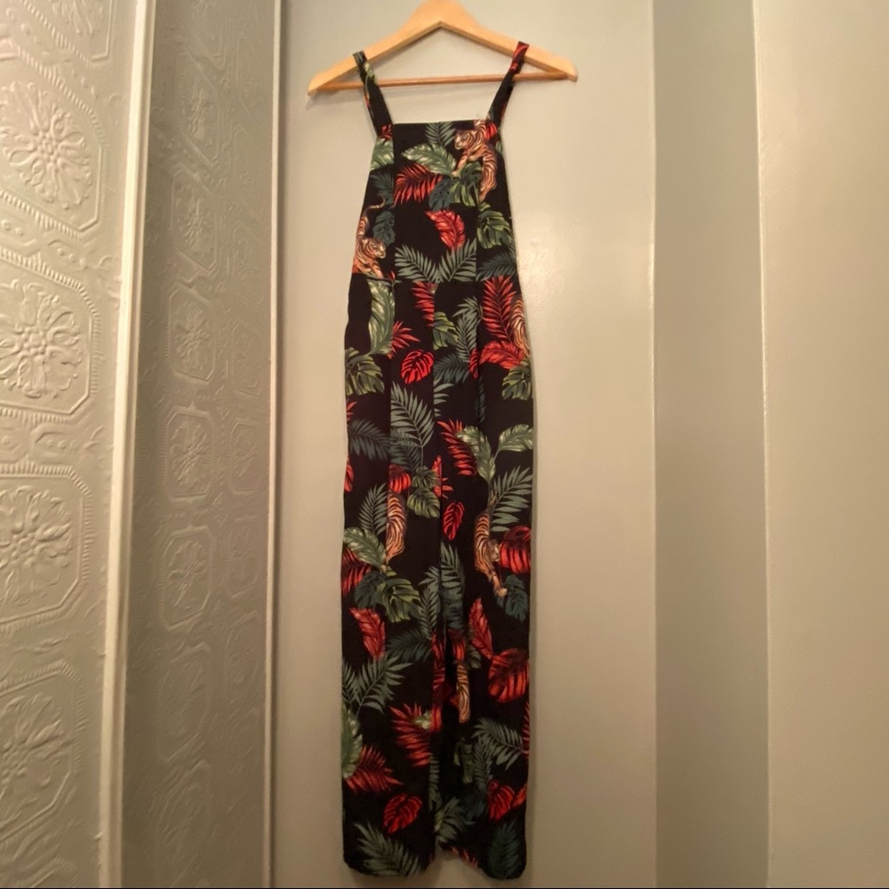 Black fitted romper with floral design, Size XS, wide leg bottoms